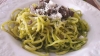 Tagliolini all'uovo, pesto di rucola, salsiccia e guanciale